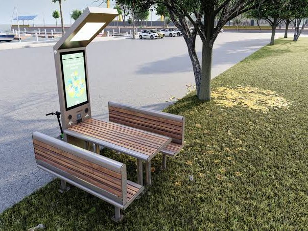 Conjunto de bancas y mesa con pérgola solar y punto de carga en una zona verde